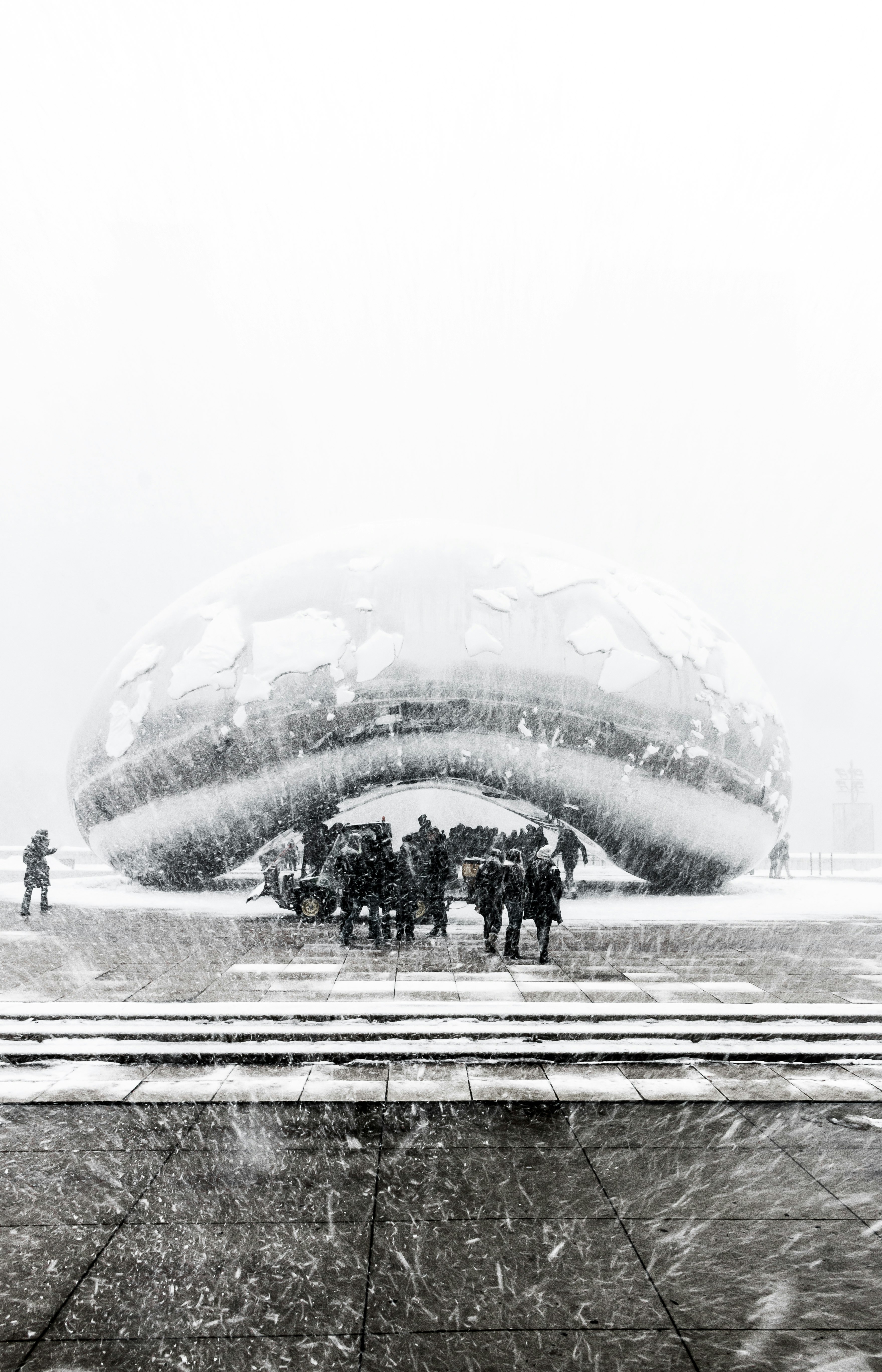person under cloud gate at Chicago